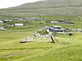 The church in Skálavík and a part of the village.