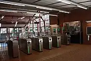 Ticket barriers and escalator access to the underground platform