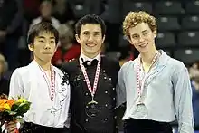 Rippon (right) at the 2010 Skate Canada International podium