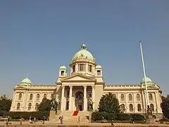 Front of the building under a blue sky