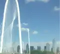 Margaret Hunt Hill Bridge with Dallas skyline in background (May 2014)