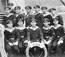 a black and white photograph of a group of uniformed men