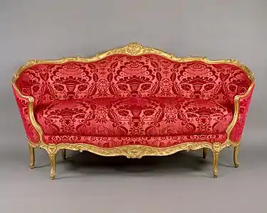 An Ottomane sofa (1750-60) by Jean Baptiste Tilliard,  in an oval shape, an example of the Turquoise or Turkish style