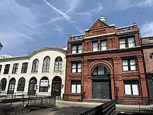 The building has a pedestrian bridge serving East Bay Street. Savannah District Authority was formerly based in the white building