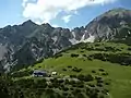 The Solsteinhaus, following its 2007 renovation, in front of the Kuhljochspitze (left) and Erlspitze (right)