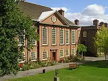 red brick neo-classical exterior of large building