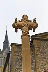 Monumental cross of the 15th century, historical monument since 1926, in front of the church