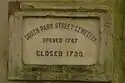 The marble plaque which reads: "South Park Street Cemetery, opened 1767, closed 1790"