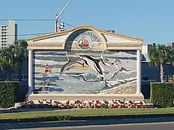 A sign bearing the seal and motto of South Pasadena, Florida.