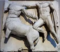 Sculpture of a man fighting a centaur.