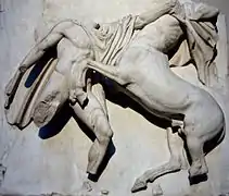 Sculpture of a man fighting a centaur.