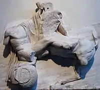 Sculpture of a man fighting a centaur.