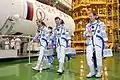 Crew members during a suited "fit check" of the Soyuz TMA-07M spacecraft at the Baikonur Cosmodrome.