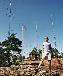 A young woman wearing t-shirt and shorts at the warm summer in Åland