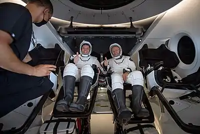 Robert Behnken, and Douglas Hurley are seen inside Endeavour onboard GO Navigator after splashdown.