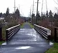 This straight portion parallels Johnson Creek Boulevard and crosses many intersecting streets.