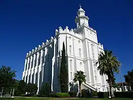 The St. George Temple from a distance looking up at the southeast corner, showing battlements and parapets, and the cupola. Taken before undergoing the 2019-2023 renovations, taken in 2006.