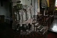 Pulpit featuring reliefs of archangels, from left: Michael, Gabriel, Uriel