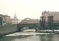 Southern part of the bridge in March 2007. In the background are the Riksdag building, Mynttorget, and Riddarholmskyrkan.