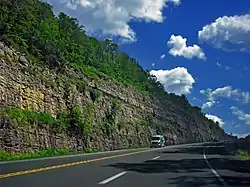 The construction of U.S. Route 6 exposed geologic layers in Standing Stone Township.