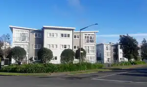 Coloured image of two apartment buildings