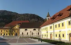 Stara Sava, the main square. From the left to the right,  the Ruard Manor, Assumption of Mary Church, the Worker Barracks