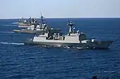 ROKS Chungmugong Yi Sun-shin and USS John Paul Jones alongside each other during RIMPAC 2004.