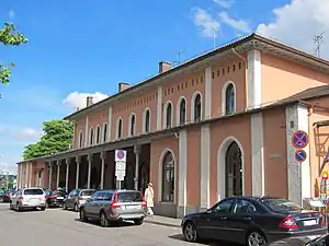 Wide two-story building with hip roof