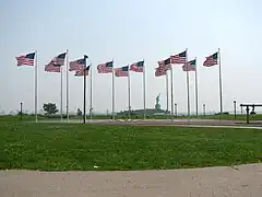 View of the Statue of Liberty from the site of the explosion: The explosion caused $100,000 worth of damage to the statue, and from then onward the torch has been closed to tourists.