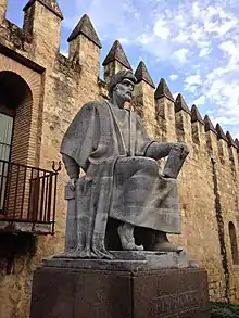 Statue of a sitting man in Arabic garb