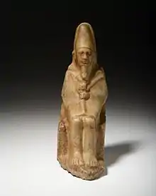 Small statue of Nynetjer wearing ceremonial clothes of the sed festival. Currently held at the Rijksmuseum van Oudheden at Leiden (Netherlands).