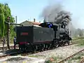 Heritage steam locomotive filling up with water on a Treno Natura service.