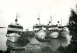 Passenger steam ships S/S Jyväskylä, S/S Suomi, S/S Taru and S/S Tehi in Pihlajakoski harbour, Kuhmoinen in 1938