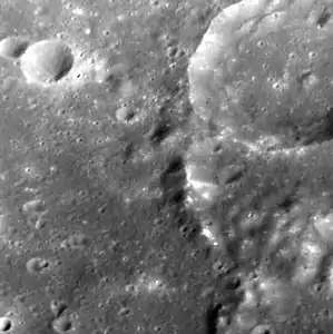 Hollows on mountain within Steichen crater