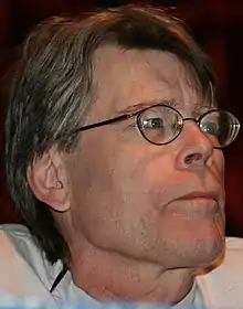 A man's face with glasses