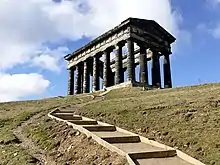 A monument in the form of a Greek temple on a hill