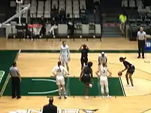 Image 5A player from Webber International  (black jersey) attempts a free throw against Stetson University (white jerseys). November 30, 2018.  (from Women's basketball)