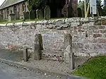 Parish stocks outside St Luke's parish church, Weston