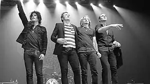 Stone Temple Pilots' original lineup in Manila, Philippines on March 9, 2011. From left to right: Dean DeLeo, Scott Weiland, Eric Kretz, and Robert DeLeo.