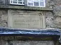 Stone panel in 10 Firwood Fold announcing that Samuel Crompton was born in the house on 3 December 1753.