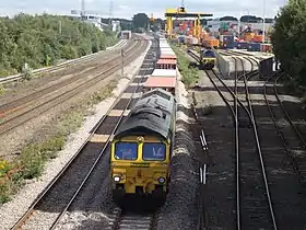 A railway locomotive with containers at an unloading centre