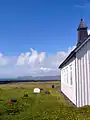 Strandarkirkja - exterior grounds with view of some graves