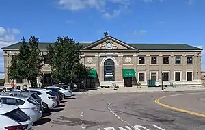 A large railroad station building in an urban area