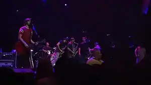 Streetlight Manifesto performing at the Mayan Theatre in 2012. Left to right: Kalnoky, Thatcher, Brown, Conti, Nirenberg, McCullough, and Stewart.