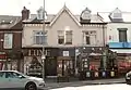 Two-storey building with shops on lower storey