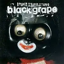 A close-up of a plastic toy with googly eyes against a black background