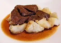 Sudderlapjes is slowly simmered beef, most often served with potatoes.