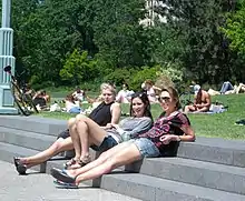 Image 114Women in casuals relaxing at a park in USA, 2010 (from 2010s in fashion)