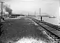 Road bed of new Lakeshore Road, 1914. Dredging boat at right.