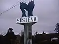 The Village sign